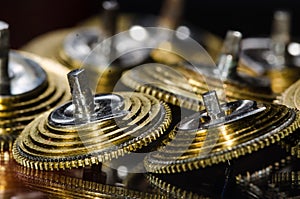 Vintage Pocket Watch Fusee Cones Resting on a Black Surface