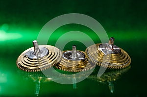 Vintage Pocket Watch Fusee Cones Resting on a Green Surface
