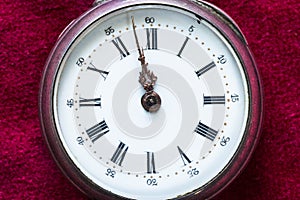 vintage pocket watch on red velvet close up