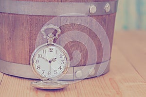 Vintage pocket watch on wooden