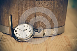 Vintage pocket watch on wooden