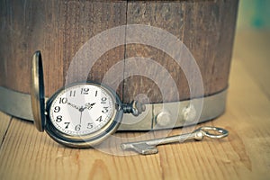 Vintage pocket watch on wooden