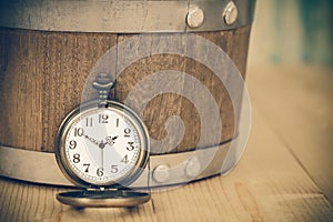 Vintage pocket watch on wooden