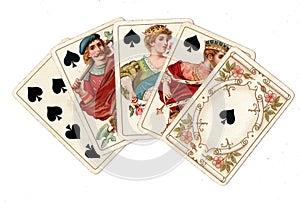 Vintage poker playing cards showing a royal flush of spades.