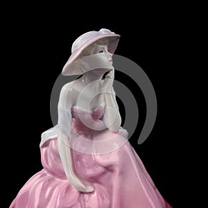 Vintage porcelain figurine of a woman in a long  pink dress