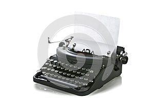 Vintage portable typewriter with paper