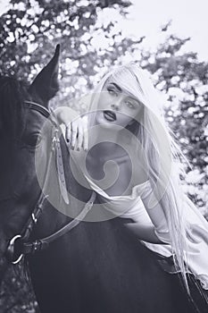 Vintage portrait of beautiful girl horse riding