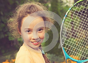 Vintage portrait of cute girl playing tennis in summer