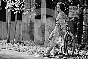 Vintage portrait of a girl with bike