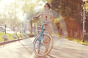 Vintage portrait of a girl with bike