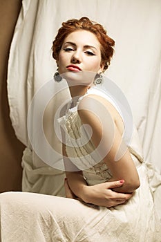 Vintage portrait of glamourous queen like girl in bedroom