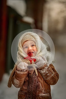 Vintage portrait of little girl with lollipop