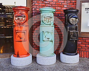 Vintage post box in front of a souvenir shop