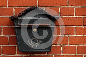 Vintage postbox on brick wall