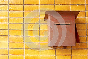 Vintage postbox on brick wall