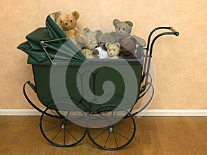 Vintage pram with teddy bears