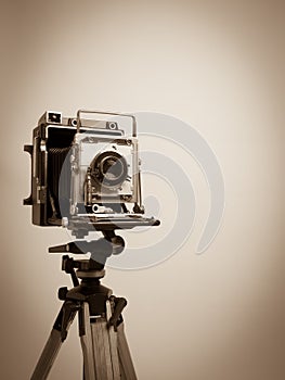 Vintage Press Camera on Wooden Tripod