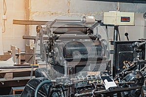 Vintage printing machine for carving in printing. Part of the old mechanism, regulators, gears