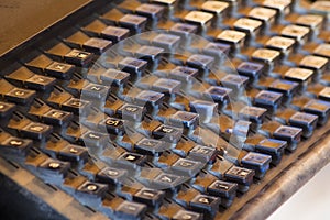 Vintage Printing Press Keyboard Covered in Dust and Grit photo