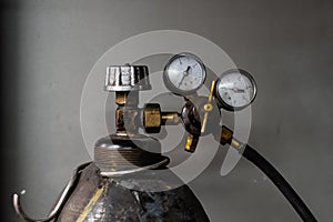 Vintage propane gas tank with pressure meters. Close-up image of