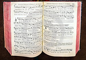 Vintage psalm book with chorus singing notes