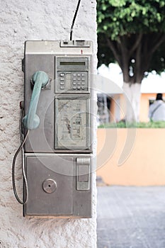 Vintage public payphone abandoned old and obsolete