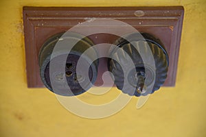 Vintage put light switch on wall. Ancient power switch.