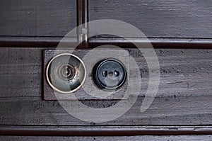 A Vintage put light switch on wooden interior wall