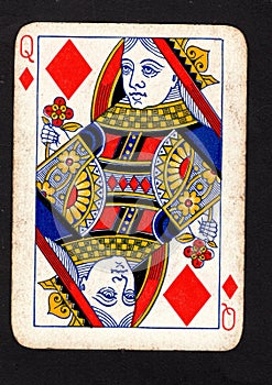 A vintage queen of diamonds playing card on a black background.