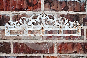 Vintage rack on red brick wall photo