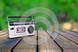 Vintage radio player on wood walk