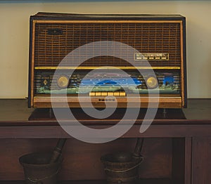 Vintage Radio on the top of Wood Shelf