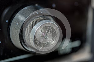 Vintage radio tuning knob close-up . blurred background. small focusing area, selective focus