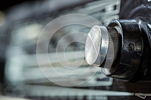 Vintage radio tuning knob close-up . blurred background. small focusing area, selective focus