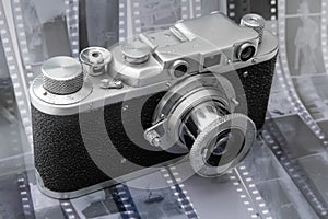 Vintage rangefinder camera over black and white film photo
