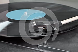 Vintage record player with spinning vinyl. Motion blur image.