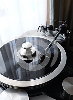 Vintage record player with tonearm closeup view