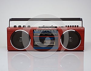 Vintage red boom box on white background