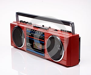 Vintage red boom box on white background photo