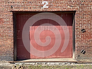 Vintage red brick wall building background red dock door
