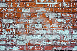 Vintage Red Brick Wall Texture with pieces of old paper adverts