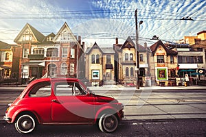 Vintage red car in the urban street. Toronto
