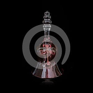 vintage red glass festive bell on black isolated background