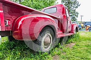 A vintage red GMC pickup truck