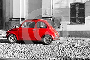 Red vintage italian car on black and white background