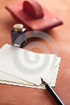 Vintage red leather ink blotter with retro post cards on leathe