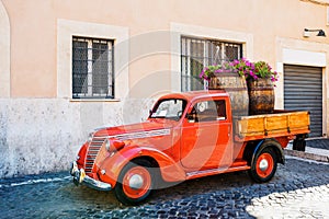 Vintage red pickup on street in Trastevere