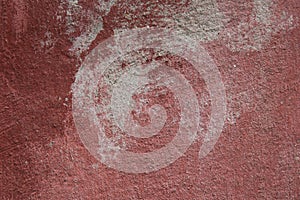 Vintage red plaster with paint stains
