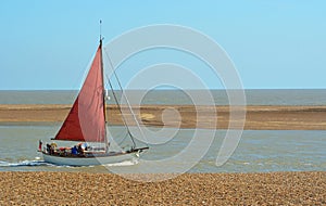 Vintage Red Sailed Boat at Felixstowe Ferry