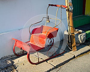 Vintage red sled without snow around